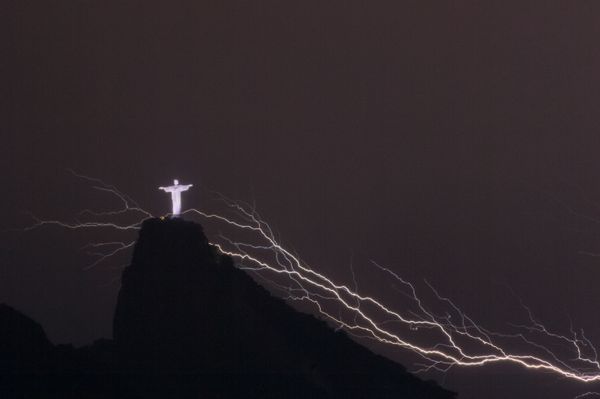 Lightning flashes over the Christ the Redeemer statue on top of Corcovado Hill in Rio de Janeiro Lightning flashes over the Christ the Redeemer statue on top of Corcovado Hill in Rio de Janeiro - Sputnik International