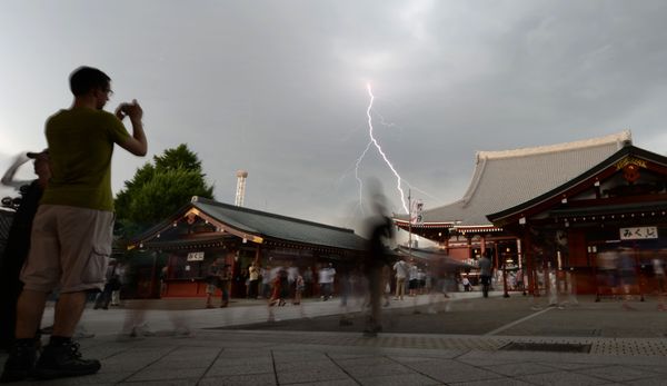 Bolts of lightning strike as people visit Tokyo's Sensoji temple during the preview of the annual two-day Chinese lantern plant fair in Tokyo on 8 July 2013 Bolts of lightning strike as people visit Tokyo's Sensoji temple during the preview of the annual two-day Chinese lantern plant fair in Tokyo on 8 July 2013 - Sputnik International