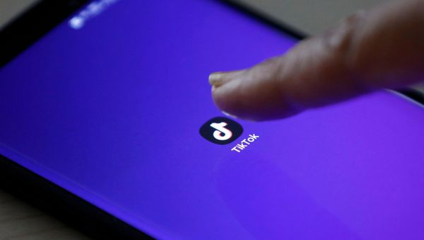 TikTok logo on a mobile phone screen - Sputnik International