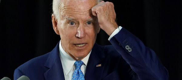 Democratic U.S. presidential candidate and former Vice President Joe Biden gestures with his fist towards his head as he says he has not been tested for coronavirus because he has had no symptoms as my mother would say, knock on wood while answering questions from reporters during a campaign event in Wilmington, Delaware, U.S., June 30, 2020. Democratic U.S. presidential candidate and former Vice President Joe Biden gestures with his fist towards his head as he says he has not been tested for coronavirus because he has had no symptoms as my mother would say, knock on wood while answering questions from reporters during a campaign event in Wilmington, Delaware, U.S., June 30, 2020. - Sputnik International