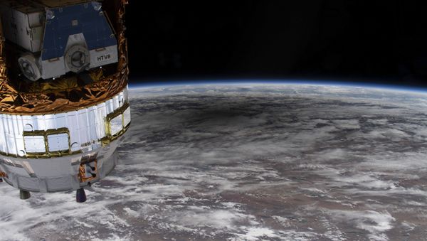 This NASA photo released on June 24, 2020 shows as the International Space Station orbited over Kazakhstan and into China, an external high-definition camera image of the solar eclipse shadowing a portion of the Asian continent on June 21, 2020 - Sputnik International
