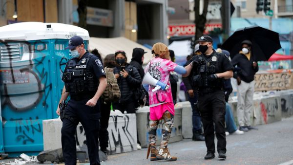 FILE PHOTO: Seattle Police officers leave the scene of a fatal shooting without incident in the CHOP (Capitol Hill Organized Protest) area as people occupy space in the aftermath of the death in Minneapolis police custody of George Floyd, in Seattle, Washington, U.S. June 29, 2020 - Sputnik International