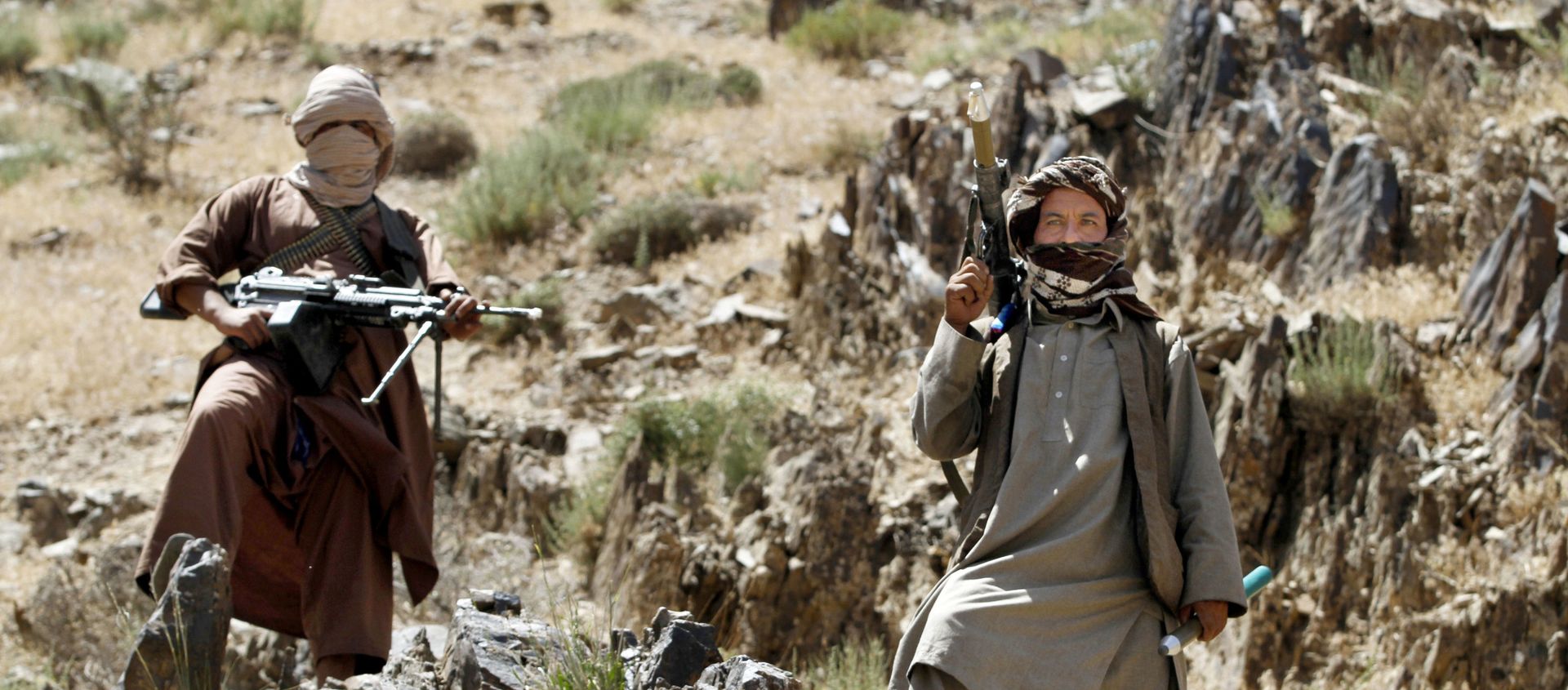In this Friday, May 27, 2016 photo, Taliban fighters stand guard as senior leader of a breakaway faction of the Taliban Mullah Abdul Manan Niazi, not pictured, delivers a speech to his fighters, in Shindand district of Herat province, Afghanistan - Sputnik International, 1920, 23.07.2021