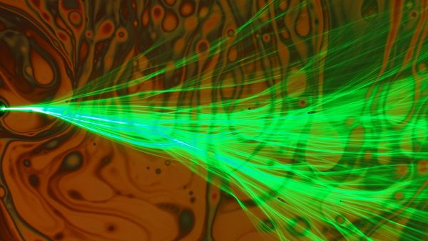Branched flow, with bubbles in the background, as observed through a microscope at the Technion - Sputnik International