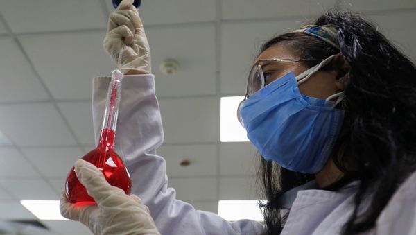 A pharmacist doctor works on the basics of the raw materials for investigational of the coronavirus disease (COVID-19) treatment drug Remdesivir, in Ibn Sina laboratory, at Eva Pharma Facility in Cairo, Egypt 25 June 2020. - Sputnik International