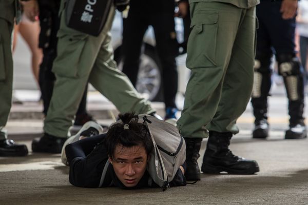 Riot police detain a man as they clear protesters taking part in a rally against a new national security law in Hong Kong on July 1, 2020, on the 23rd anniversary of the city's handover from Britain to China Riot police detain a man as they clear protesters taking part in a rally against a new national security law in Hong Kong on July 1, 2020, on the 23rd anniversary of the city's handover from Britain to China - Sputnik International