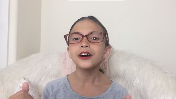 Screenshot of @RealMiniAOC Video  - Sputnik International