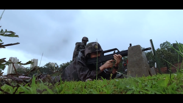 The Chinese People's Liberation Army's Hong Kong garrison engages in target practice in a training video posted on its Sina Weibo account - Sputnik International