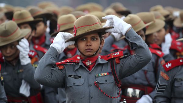 Indian Para-military women soldiers of Assam Rifles adjust their hats during the rehearsals for the upcoming Republic Day parade on Rajpath, the ceremonial boulevard, in New Delhi, India, Monday, Jan. 14, 2019 - Sputnik International