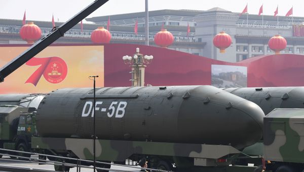 Military vehicles carrying DF-5B intercontinental ballistic missiles participate in a military parade at Tiananmen Square in Beijing on October 1, 2019, to mark the 70th anniversary of the founding of the People's Republic of China.  - Sputnik International