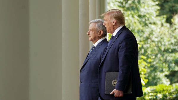 U.S. President Donald Trump leads Mexico's President Andres Manuel Lopez Obrador down the West Wing colonnade to a signing ceremony in the Rose Garden at the White House in Washington, U.S., July 8, 2020. - Sputnik International