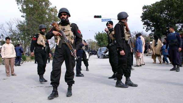 Riot police guards a mourning procession in memory of Shi'ite Imam Husain Riot police guards a mourning procession in memory of Shi'ite Imam Husain - Sputnik International