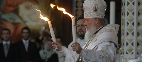 Patriarch Kirill of Moscow and All Russia handed the Holy Fire delivered from Jerusalem to all those thousands of faithful gathered at Moscow's Christ the Savior Cathedral on the Easter Night Patriarch Kirill of Moscow and All Russia handed the Holy Fire delivered from Jerusalem to all those thousands of faithful gathered at Moscow's Christ the Savior Cathedral on the Easter Night - Sputnik International