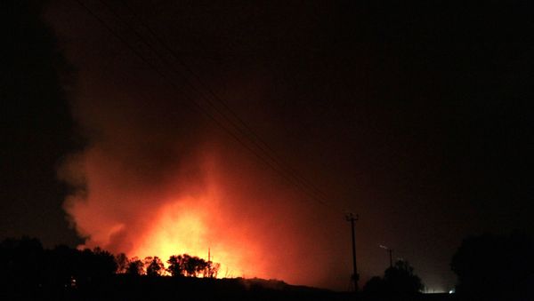 The emergencies ministry says [the fire] was most likely caused by rain. It rained heavily the day before, and rainwater could have got inside through holes in the roof, causing a chemical reaction, smoldering and toxic smoke - Sputnik International