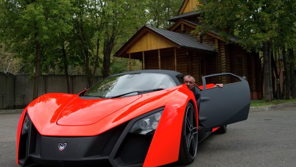 Nikolay Fomenko is seen inside a Marussia car prototype. File photo - Sputnik International