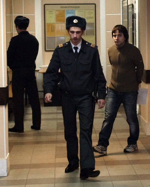 Voina president Leonid Nikolayev (right) started a fledging protest movement involving wearing a blue bucket to condemn officials' misuse of blue flashing lights Voina president Leonid Nikolayev (right) started a fledging protest movement involving wearing a blue bucket to condemn officials' misuse of blue flashing lights - Sputnik International