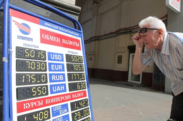 Belarus' central bank has devalued the ruble to 4,930 per dollar from 3,155, while the government has applied for a $1 billion loan from Russia and a $2 billion loan from EurAsEC. - Sputnik International