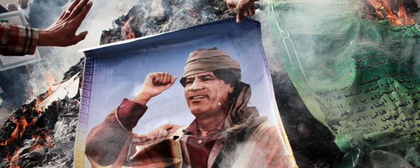 The picture of Muammar Gaddafi being burned The picture of Muammar Gaddafi being burned - Sputnik International