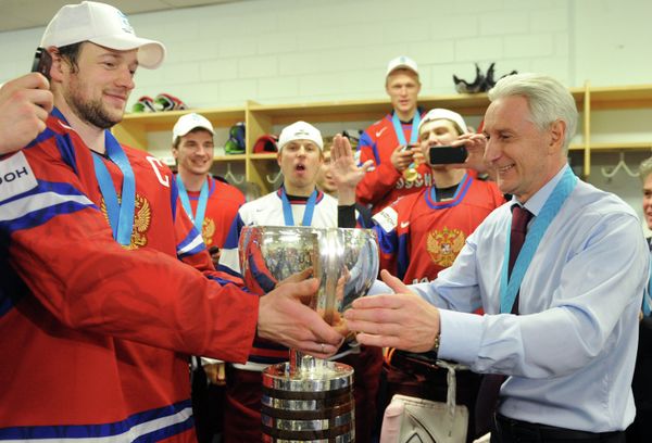 Russian team head coach Zinetula Bilyaletdinov drinks from the cup after Russia's victory over Slovakia at the world hockey championships - Sputnik International