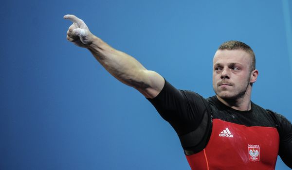 Adrian Zielinski of Poland claimed weightlifting gold by the narrowest possible margin in the men's 85kg category on Friday - Sputnik International