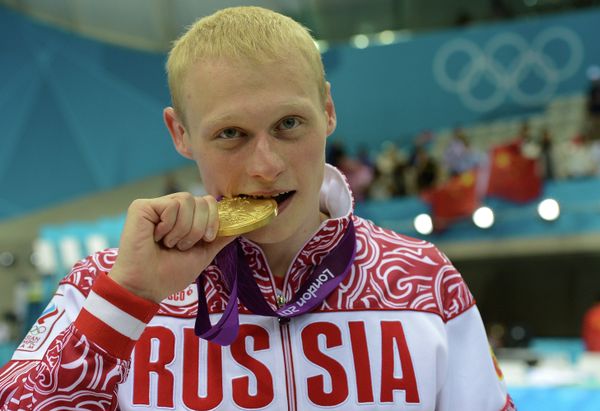 Ilya Zakharov of Russia took diving gold in the men’s three-meter springboard - Sputnik International