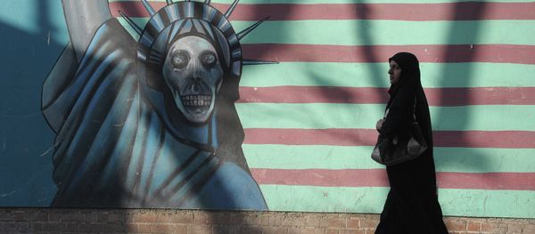 A woman walking past the outer wall of the former US embassy in Tehran, which was seized by Islamists in 1980 A woman walking past the outer wall of the former US embassy in Tehran, which was seized by Islamists in 1980 - Sputnik International