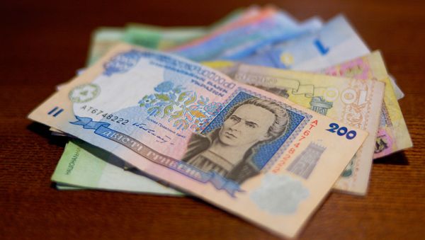 Ravaged by civil war, left with no parliament and led by a self-styled “kamikaze government”, the country is on the verge of a full-fledged economic disaster. Photo: Ukraine's currency - hryvnias. - Sputnik International