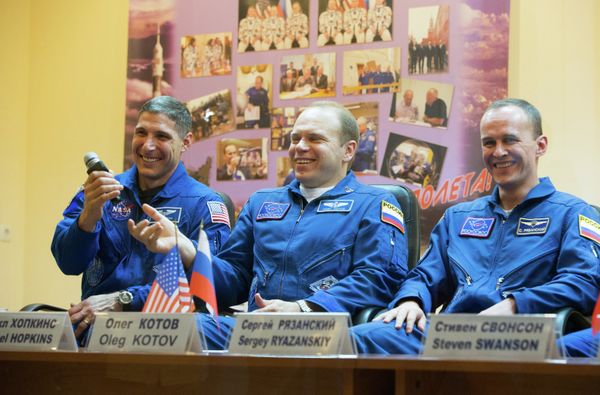 Michael Hopkins, Oleg Kotov and Sergei Ryazansky - Sputnik International