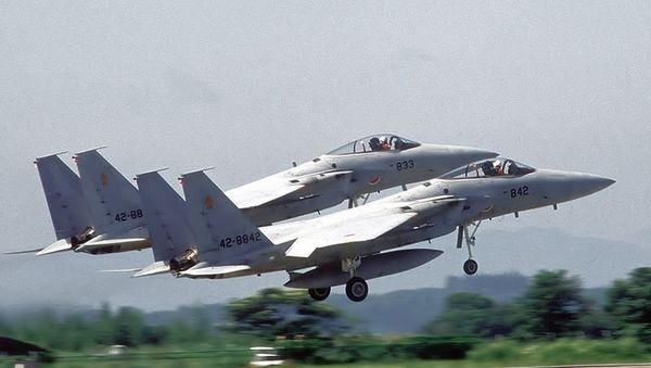 Two F-15J Eagle aircraft of the 202nd Tactical Fighter Squadron, Japanese Air Self Defense Force (JASDF), take off in formation during the joint U.S./Japan exercise Cope North 85-4. - Sputnik International