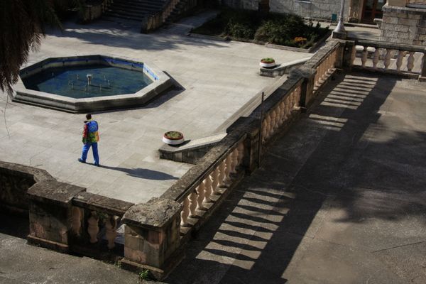 An Olympic volunteer strolling amid an extension to the sanatorium built after the Second World War An Olympic volunteer strolling amid an extension to the sanatorium built after the Second World War - Sputnik International