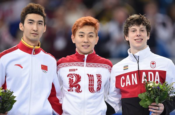 Winners of 500 m speed skating relay, Russia's Viktor Ahn (C), China's Wu Dajing (L), Charlie Cournoyer (R) - Sputnik International
