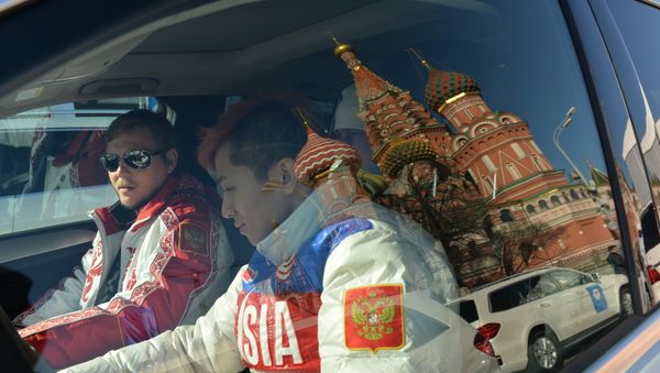 Russia's Olympic champion Viktor An (R) in a car presented to the medalists - Sputnik International