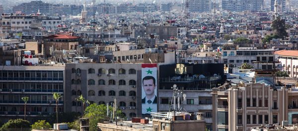 A portrait of Syrian president Bashar al-Assad on the wall of a building in central Damascus (File) A portrait of Syrian president Bashar al-Assad on the wall of a building in central Damascus (File) - Sputnik International