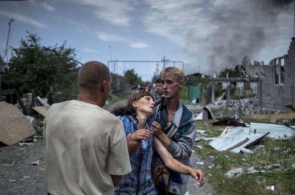 Local residents in the village of Luganskaya after the Ukrainian armed forces' air attack - Sputnik International