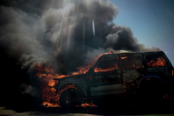 A Car Hit by a Shell during an Artillery Attack by the Ukrainian Security Forces on the Lugansk - Krasnodon Highway. - Sputnik International