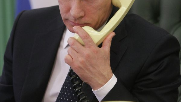 Putin expressed his concern about the humanitarian situation in Ukraine during a telephone conversation with German Chancellor Merkel - Sputnik International