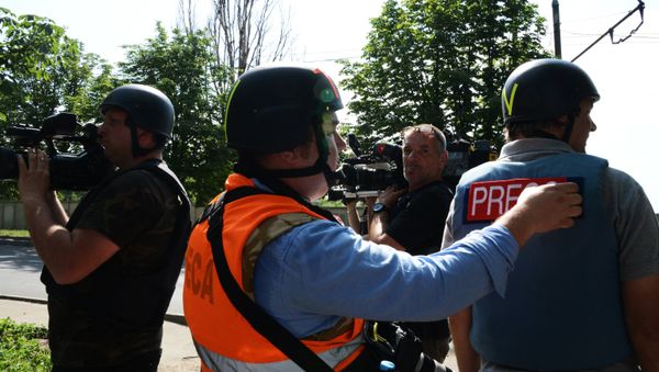 Journalists working in a hot spot - Sputnik International