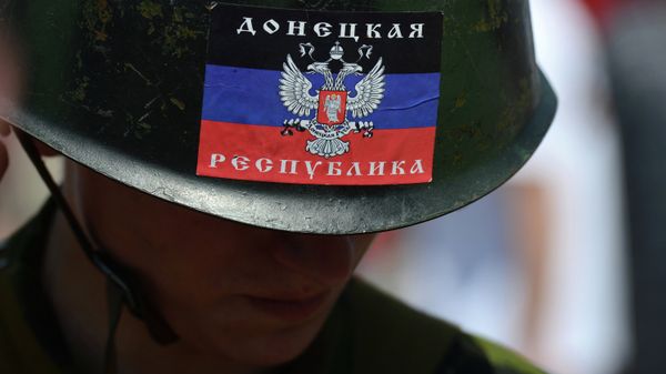 Participant of a rally in support of the Donetsk People's Republic in the city of Donetsk in eastern Ukraine - Sputnik International