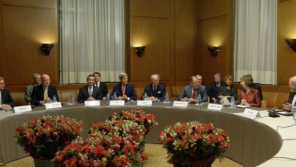 Foreground, from left: German Foreign Minister Guido Westerwelle, UK Foreign Secretary William Hague, Chinese Foreign Minister Wang Yi, US Secretary of State John Kerry, French Foreign Minister Laurent Fabius, Russian Foreign Minister Serei Lavrov, EU foreign policy chief Catherine Ashton and Iranian Foreign Minister Mohammad Javad Zarif during the talks on Iran's nuclear program, in Geneva (File). - Sputnik International