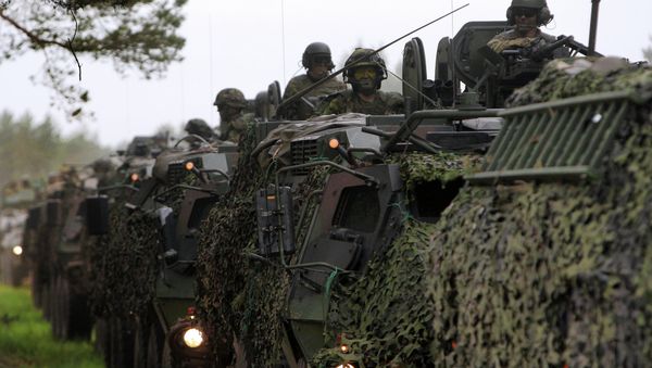 US, Estonian, Latvian, Lithuanian, and British soldiers conduct a convoy into the training field. - Sputnik International