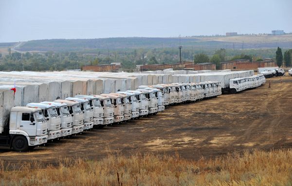 The first 70 trucks have returned to Russia after delivering humanitarian aid to Ukraine’s eastern city of Luhansk - Sputnik International