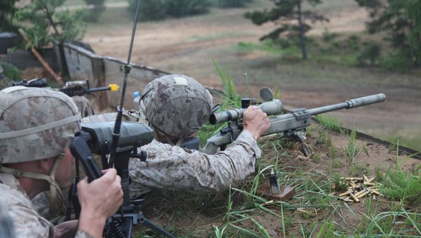 A US Marine takes aim at a long range target at the live fire range on Base Camp Adazi, Latvia on June 15, 2012 A US Marine takes aim at a long range target at the live fire range on Base Camp Adazi, Latvia on June 15, 2012 - Sputnik International