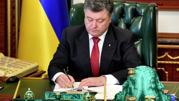 “The president [Petro Poroshenko] has signed a law paving the way for the trial of Yanukovych,” presidential spokesman Svyatoslav Tsegolkowrote in his Twitter. - Sputnik International