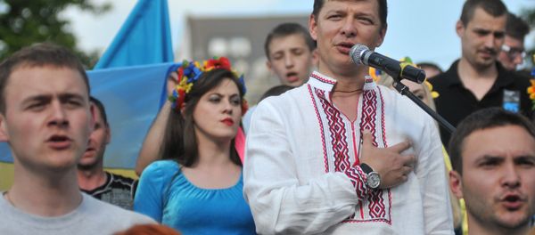 Oleh Lyashko, the leader of Ukraine’s Radical Party, savagely attacked a road sign with the message that read “I’m Russian and I’m Proud.” - Sputnik International